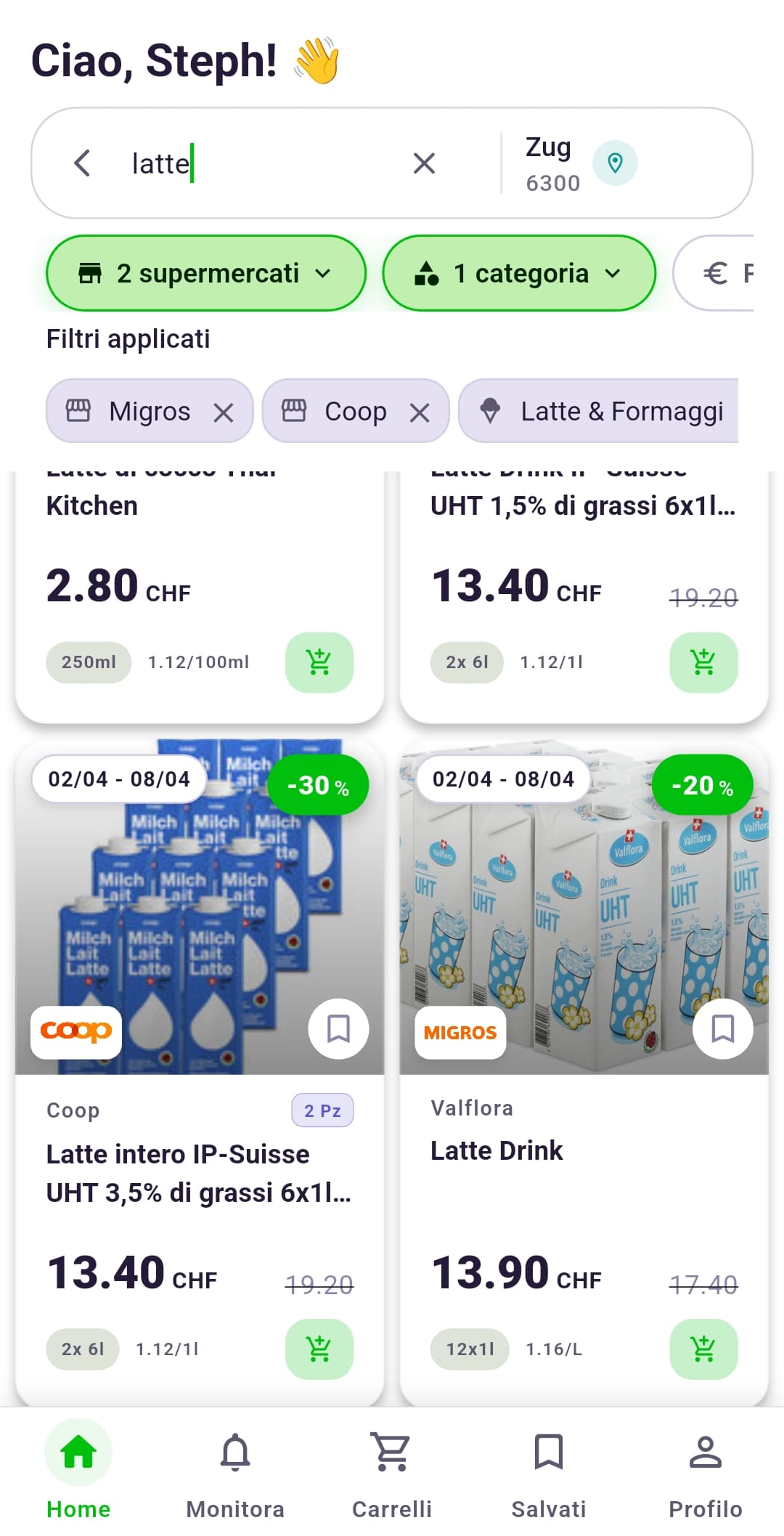 L'app Rappn su uno smartphone con le offerte in corso di più catene svizzere, accanto a un vassoio di un ristorante self-service