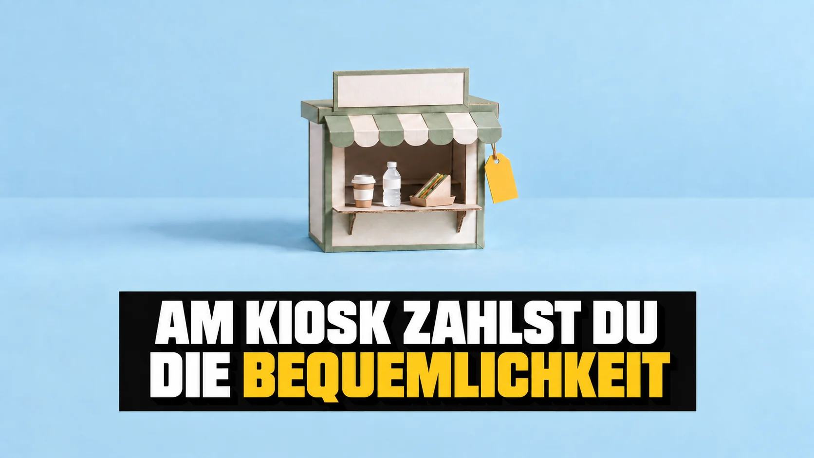 Kartonmodell eines neutralen Kiosks mit leerem Schild auf blauem Grund.