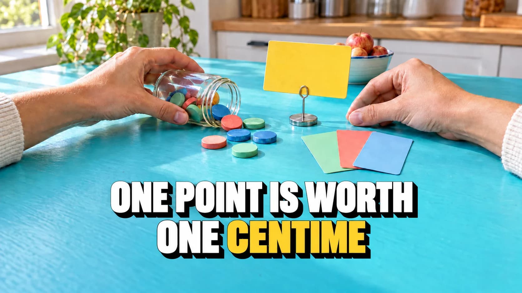 Hands, blank cards, smooth tokens and an apple on a table.