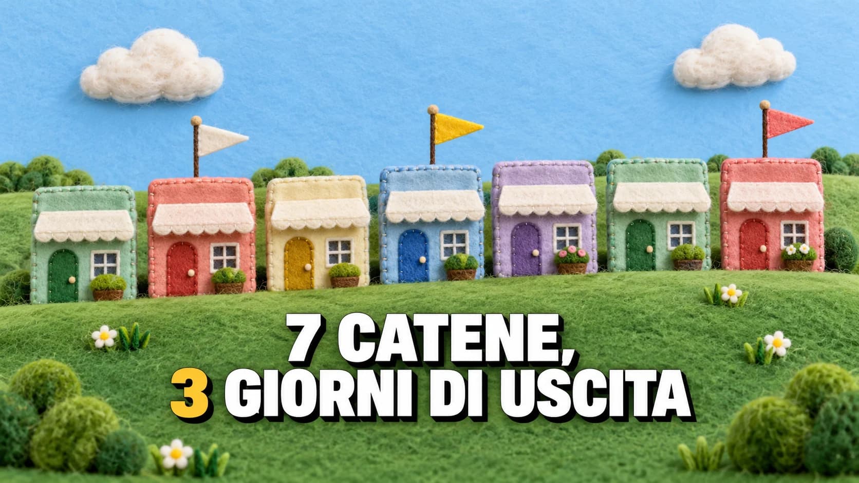 Scena in feltro con sette piccole vetrine cucite allineate su una collina verde, tre delle quali hanno una bandierina sul tetto